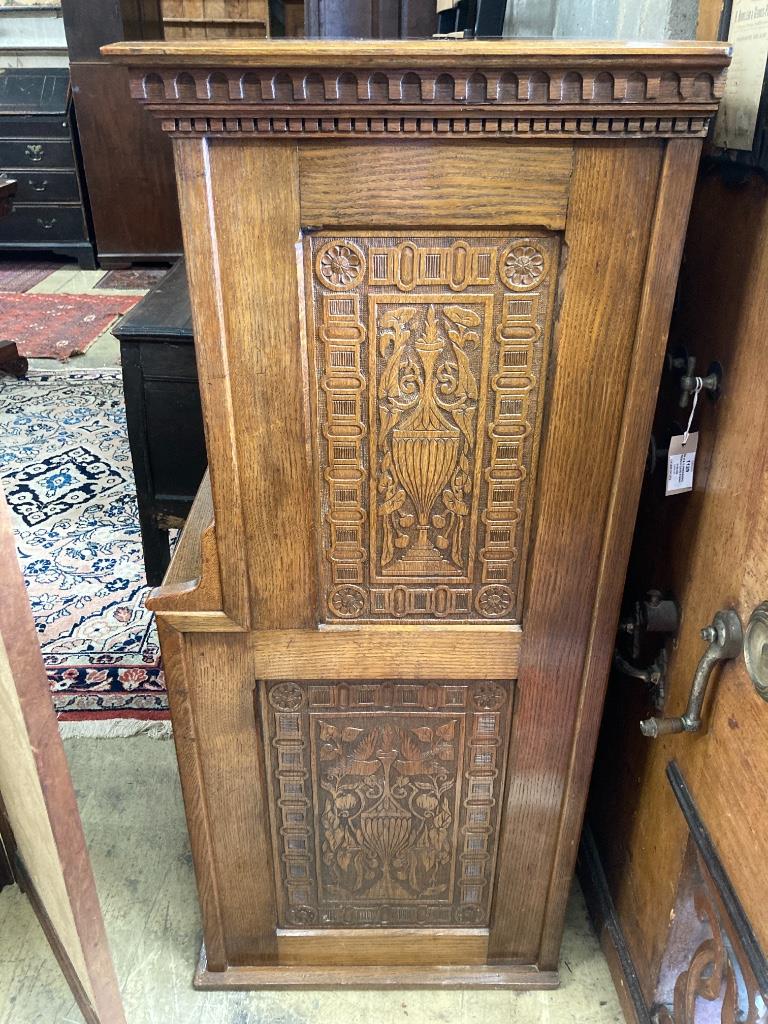 An Arts & Crafts oak escritoire, the cabinet was made out of oak shaft of the Taplow Court Mill Wheel (1845-1902) and presented by Edward Lodge in 1911, width 98cm, depth 52cm, height 122cm